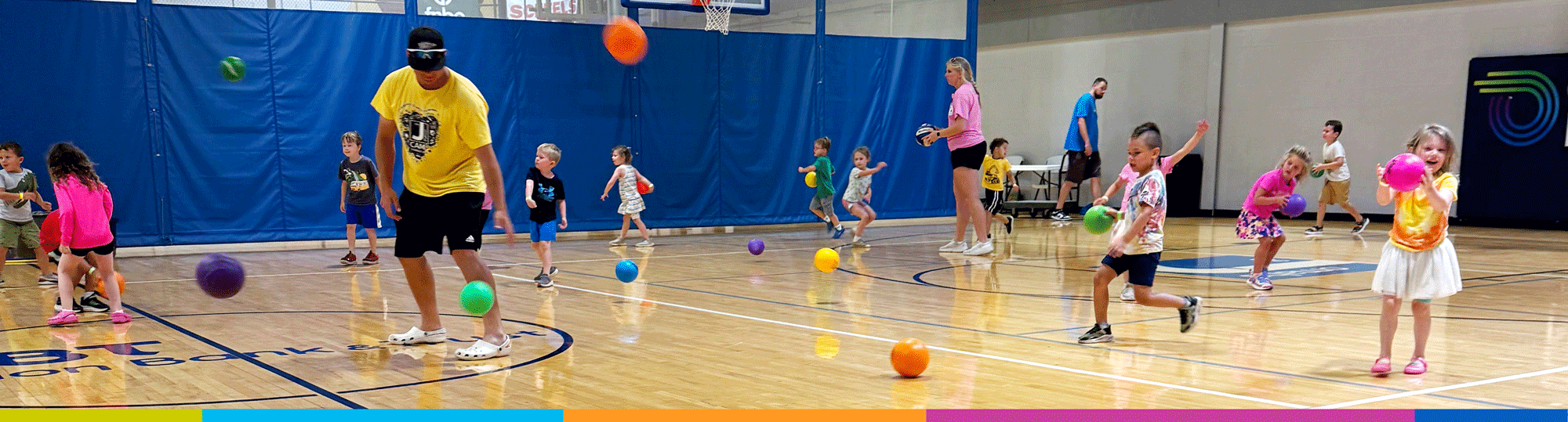 jcc-hero-banner-youth-kids-playing-with-balls-gymnasium