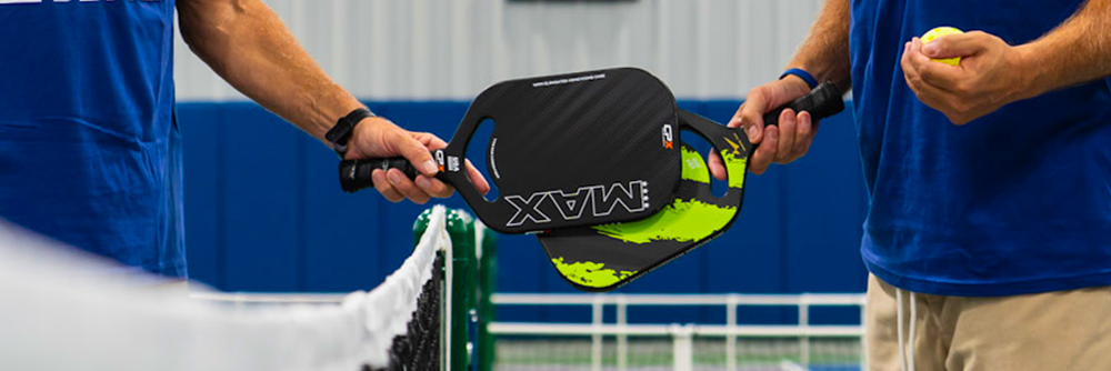 Pickleball and JCC Members with pickeball rackets and Never Looked Better tshirts