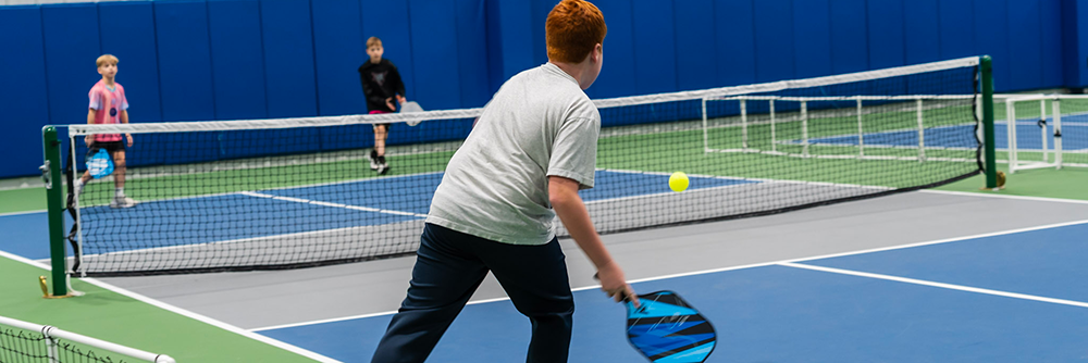 Aerial view off JPC members playing pickleball on the Pickleball courts.